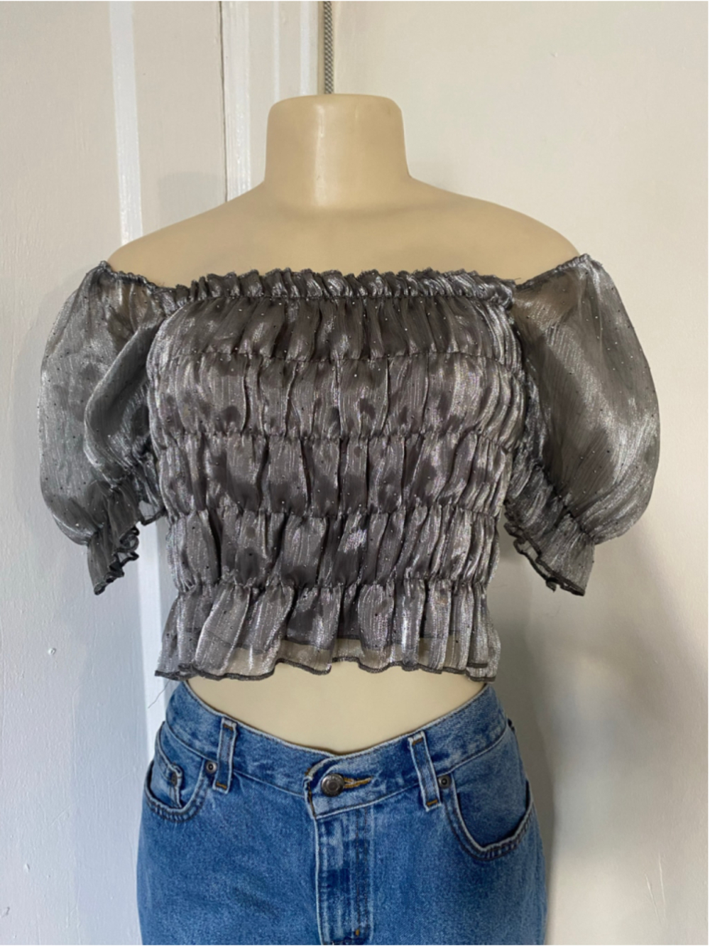 Silver metallic off the shoulder blouse with ruched detailing
